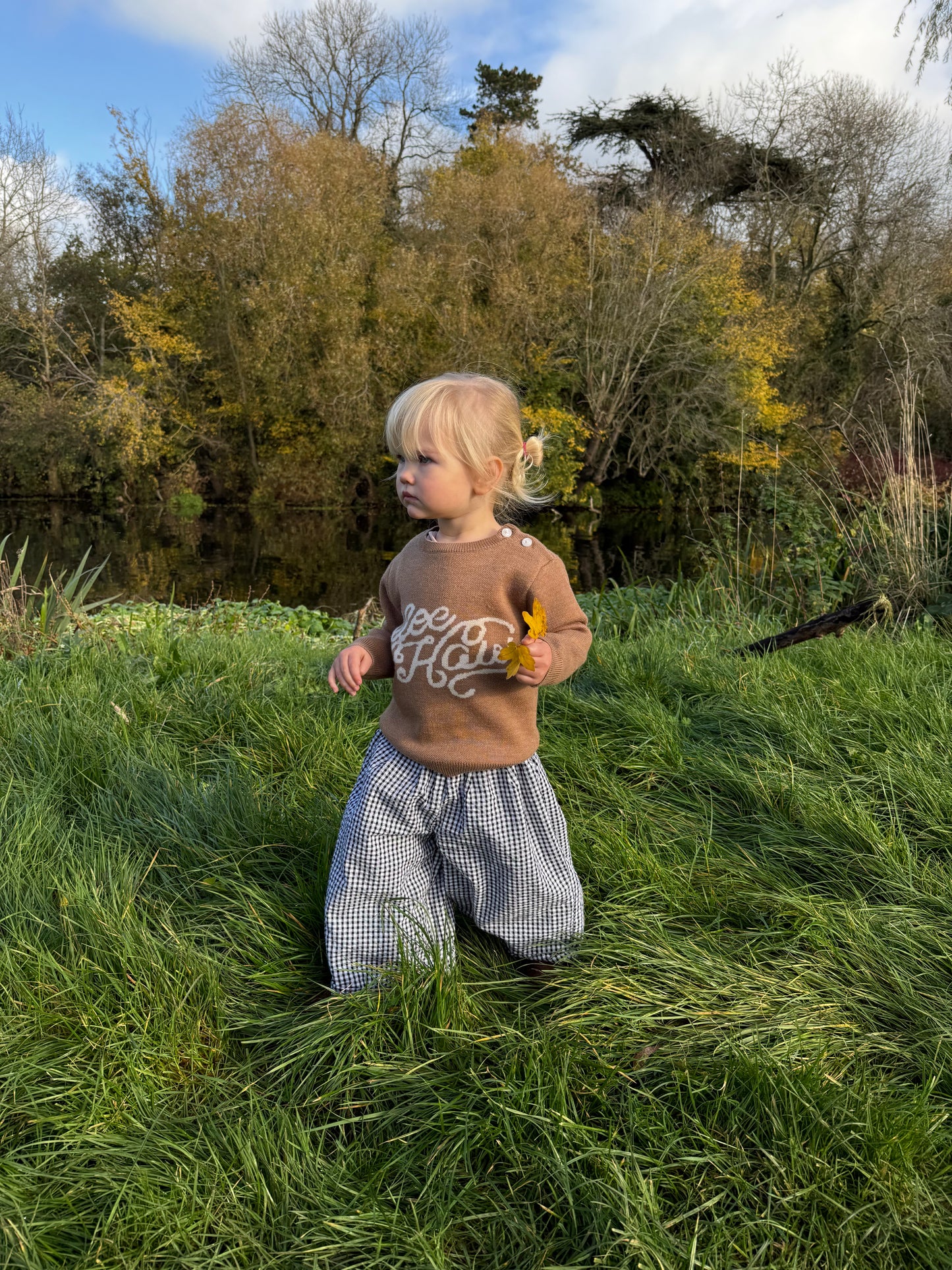 Brown knitted kids’ merino wool sweater with western-themed yeehaw graphic