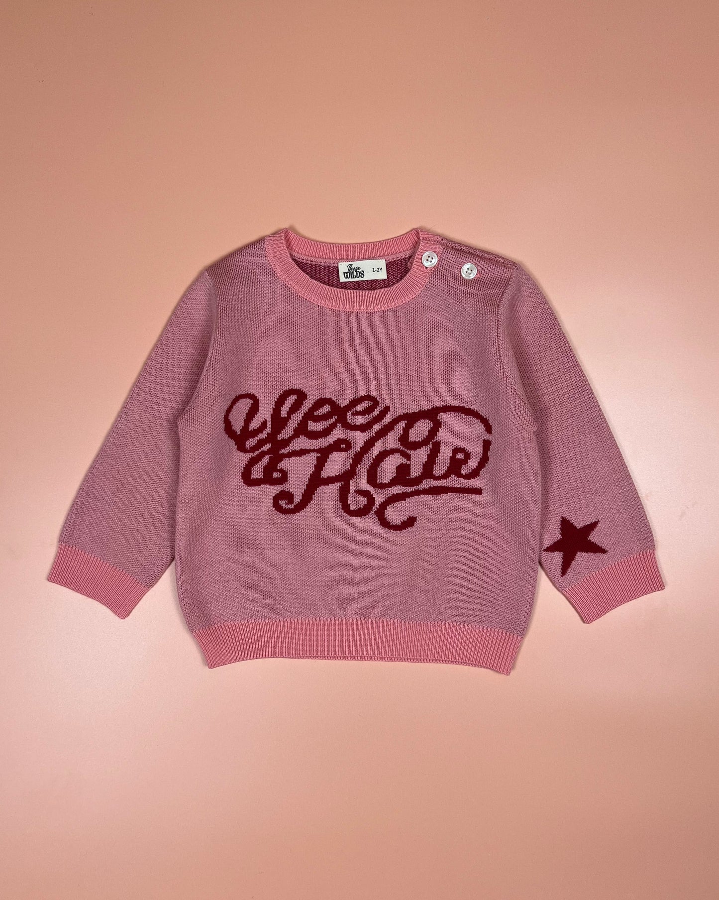 Warm pink merino wool jumper for kids with fun yeehaw design