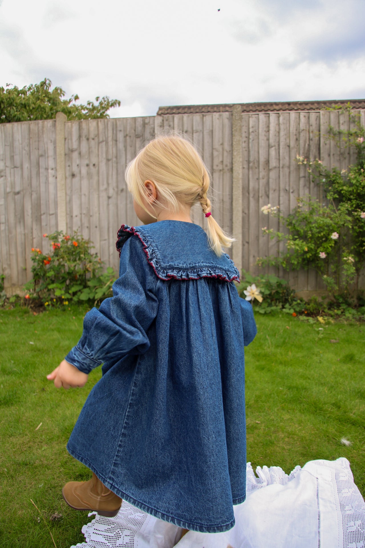 girls vintage inspired organic cotton sailor smock dress with frill collar and cowgirl boots styled for toddler