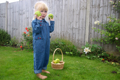 Kids vintage-inspired denim jumpsuit with cherry embroidery and zipper front, retro wash toddler girl boiler suit for ages 1 to 5.