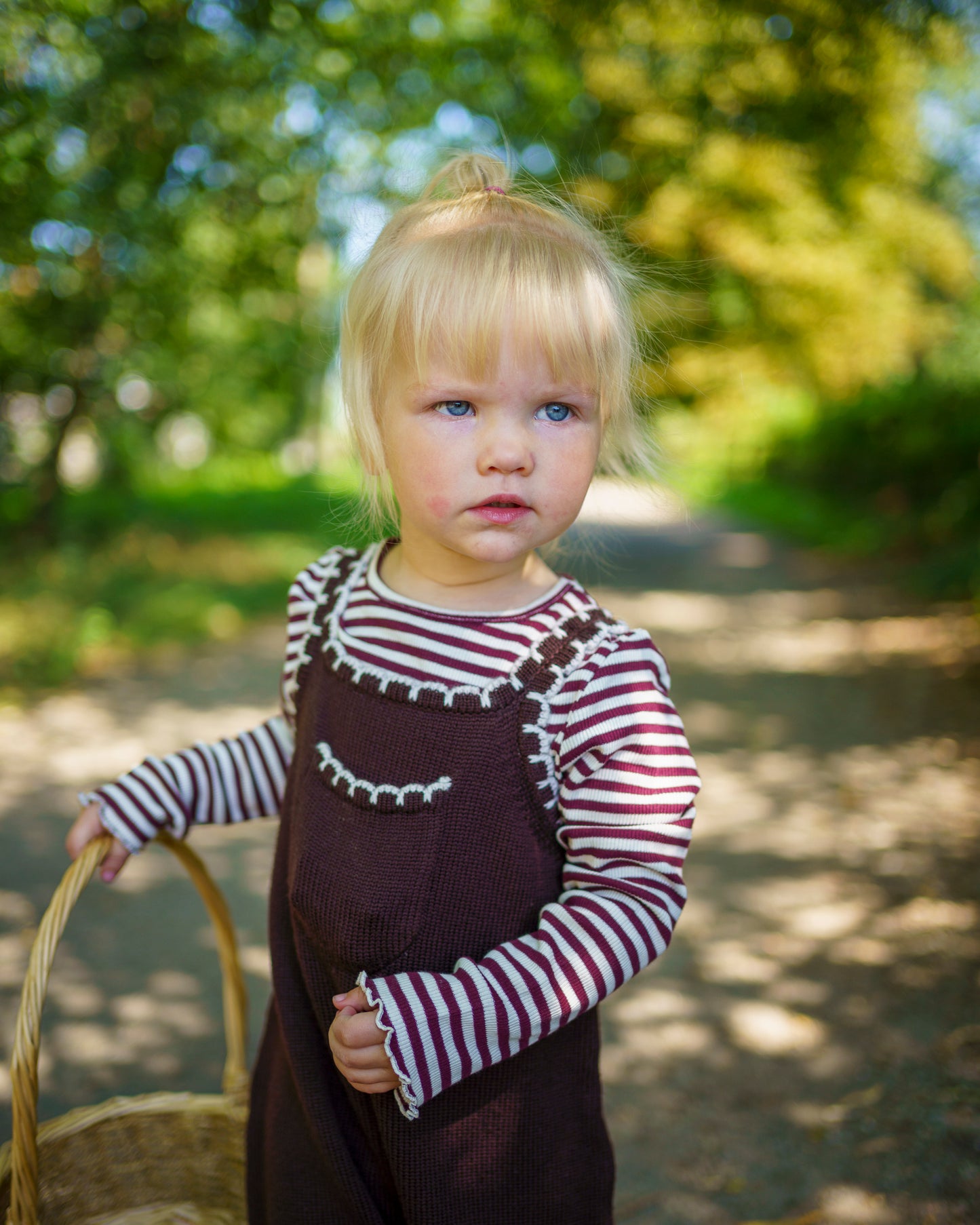 Children’s knitted brown merino wool dungarees with delicate white scallop detailing