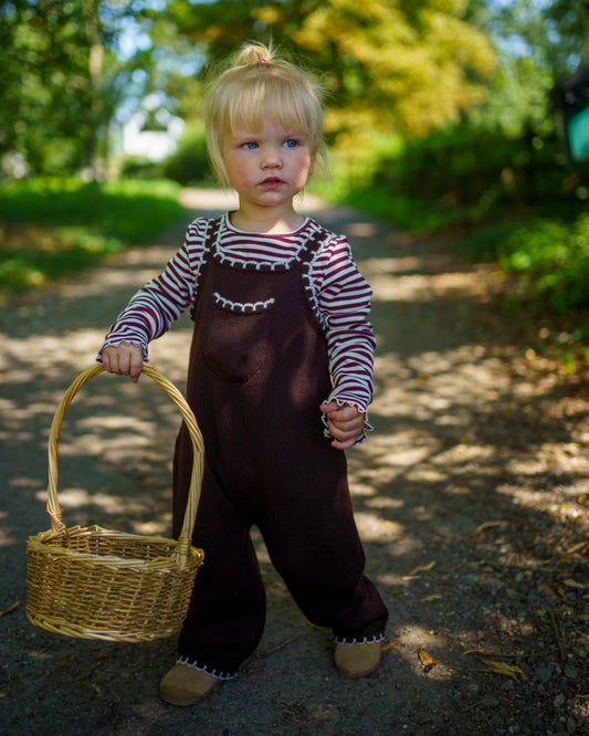 Children’s brown merino wool dungarees with adjustable straps and white scallop detail