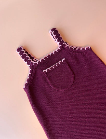 Kids’ plum merino wool overalls with adjustable shoulder straps and pink scallop accents