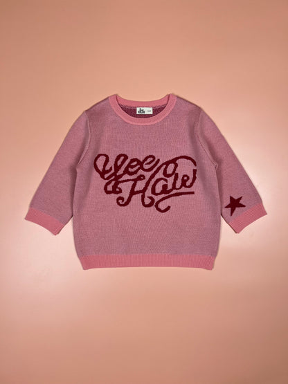 Soft pink children’s merino wool jumper featuring a cute yeehaw motif.