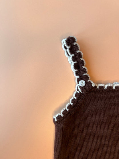 Brown merino wool kids’ dungarees featuring adjustable straps and white scallop trim